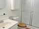 Bathroom featuring a glass-enclosed shower, a vanity with sink, and white cabinetry at 7429 Ashbury Ct, Raleigh, NC 27615