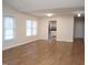 Open-concept living room with laminate flooring and natural light at 7429 Ashbury Ct, Raleigh, NC 27615