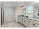 Bright bathroom with double vanity, granite counters, and tile floors at 801 Walker Ridge Way, Willow Springs, NC 27592