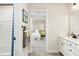 Hall bath leading into bedroom with a bright butterfly picture, shower with blue and white curtain, and double vanity at 801 Walker Ridge Way, Willow Springs, NC 27592