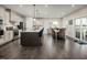 Well-lit kitchen and dining area featuring granite countertops and a sliding glass door at 801 Walker Ridge Way, Willow Springs, NC 27592