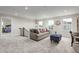 Cozy loft area with a comfortable couch and plenty of natural light at 801 Walker Ridge Way, Willow Springs, NC 27592