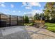 Landscaped backyard featuring a waterfall feature, decorative metalwork and a brick paver patio at 814 Ember Dr, Durham, NC 27703