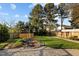 The beautifully landscaped backyard features a delightful waterfall feature at 814 Ember Dr, Durham, NC 27703