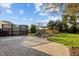 Landscaped backyard featuring a waterfall feature, decorative metalwork and a brick paver patio at 814 Ember Dr, Durham, NC 27703