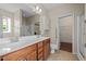Bathroom with double sink vanity, and walk-in shower, ensuring a luxurious and functional space at 814 Ember Dr, Durham, NC 27703