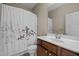 Clean bathroom features a white vanity and a shower/tub combination at 814 Ember Dr, Durham, NC 27703