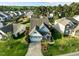 Aerial view of a well-maintained home with lush green lawns, mature trees, and a wide driveway at 814 Ember Dr, Durham, NC 27703