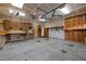 Spacious garage featuring shelving, storage, and a workbench at 814 Ember Dr, Durham, NC 27703