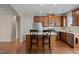 Spacious kitchen featuring a center island, wood cabinets, and stainless steel appliances at 814 Ember Dr, Durham, NC 27703