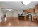 Open-concept kitchen featuring a center island with bar stools and modern stainless steel appliances at 814 Ember Dr, Durham, NC 27703