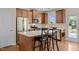 Kitchen island with stone countertop, stainless steel appliances, and wood cabinetry at 814 Ember Dr, Durham, NC 27703