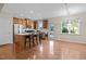 Well-lit kitchen area with a center island, stainless steel appliances, and wood cabinets at 814 Ember Dr, Durham, NC 27703