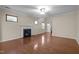 Spacious living room features a fireplace, hardwood floors, and natural light from multiple windows at 814 Ember Dr, Durham, NC 27703