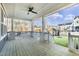 Spacious porch with white railings and brick columns, offering a great view of the neighborhood at 818 St Charles St, Durham, NC 27713