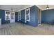 Cozy back porch with blue siding, a wooden bench, and outdoor seating for enjoying the outdoors at 818 St Charles St, Durham, NC 27713