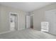 Bedroom with carpet, neutral walls, and view of multiple entrances to other rooms at 818 St Charles St, Durham, NC 27713
