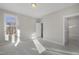 Bedroom with ensuite entrance, neutral walls, carpet, and multiple windows allowing ample natural light at 818 St Charles St, Durham, NC 27713