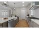 Modern kitchen features stainless steel appliances, a farmhouse sink, and sleek countertops at 818 St Charles St, Durham, NC 27713