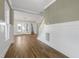 Spacious living room features beautiful hardwood floors, abundant natural light and elegant staircase at 818 St Charles St, Durham, NC 27713