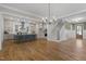 Expansive living space seamlessly connects the kitchen and living areas, highlighted by hardwood floors at 818 St Charles St, Durham, NC 27713
