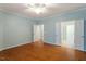 Spacious bedroom with hardwood floors, inviting doorways, and serene ambiance, perfect for relaxation at 830 Finnbar Dr, Cary, NC 27519