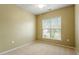 Bright bedroom with a ceiling fan and a window with natural light creating a cozy atmosphere at 830 Finnbar Dr, Cary, NC 27519