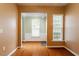 Open dining area with natural light, chair railing, and a view into another room at 830 Finnbar Dr, Cary, NC 27519