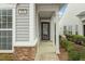 Charming covered front porch with stone accents and ample space at 830 Finnbar Dr, Cary, NC 27519