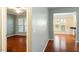 Hallway leading to dining and living areas with hardwood floors at 830 Finnbar Dr, Cary, NC 27519