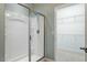 Modern glass-enclosed shower next to a walk-in closet, offering convenience and ample storage at 830 Finnbar Dr, Cary, NC 27519