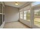 Screened-in porch featuring a ceiling fan and outdoor view at 830 Finnbar Dr, Cary, NC 27519