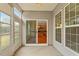 Sunroom connects to the kitchen area, featuring an outdoor view at 830 Finnbar Dr, Cary, NC 27519