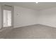 Bedroom featuring neutral walls, plush carpeting, and a view of the hallway at 841 Kenyon Spring Dr, Zebulon, NC 27597