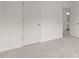 Neutral bedroom with carpeted floors, an interior door, and an adjacent bathroom at 841 Kenyon Spring Dr, Zebulon, NC 27597