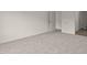 Bedroom featuring plush carpeting, neutral walls, and a view into the bathroom at 841 Kenyon Spring Dr, Zebulon, NC 27597