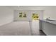 Open concept living room with carpet, hardwood, and plenty of natural light at 841 Kenyon Spring Dr, Zebulon, NC 27597