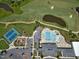Aerial view of community pool, golf course and tennis courts at 853 Rambling Oaks Ln, Holly Springs, NC 27540
