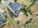 Expansive backyard featuring a patio, playground, trampoline, and lush landscaping, perfect for outdoor living and entertaining at 853 Rambling Oaks Ln, Holly Springs, NC 27540