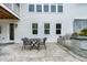 Paver patio with a built-in grill and outdoor dining area at 853 Rambling Oaks Ln, Holly Springs, NC 27540