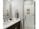 Elegant bathroom features a walk-in shower, sleek vanity, and stylish mirror for a clean, modern look at 853 Rambling Oaks Ln, Holly Springs, NC 27540