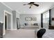 Relaxing bedroom with comfortable sofa, complemented by soft hues and lots of natural light at 853 Rambling Oaks Ln, Holly Springs, NC 27540