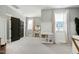 The bedroom offers light walls, soft lighting, and a charming vanity with a mirror for a bright and inviting space at 853 Rambling Oaks Ln, Holly Springs, NC 27540