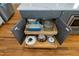 Kitchen island with gray cabinets, drawers and kitchenware to maximize your kitchen's storage space at 853 Rambling Oaks Ln, Holly Springs, NC 27540