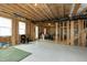 Unfinished basement area framed with a concrete floor, offering potential for customization at 853 Rambling Oaks Ln, Holly Springs, NC 27540