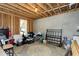 Unfinished basement showing potential with concrete floors, natural light and exposed beams at 853 Rambling Oaks Ln, Holly Springs, NC 27540