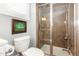 Well-lit bathroom featuring a toilet and tiled glass shower with modern fixtures at 9 Hayden Pond Ln, Chapel Hill, NC 27517