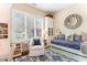 Bright bedroom featuring hardwood floors, stylish rug, and comfortable daybed with pillows and throw at 9 Hayden Pond Ln, Chapel Hill, NC 27517