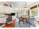 Bright breakfast nook with a round table, chair seating, workspace, and natural light from outdoor view at 9 Hayden Pond Ln, Chapel Hill, NC 27517
