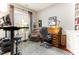 Office room featuring a wood desk, comfortable chair, and a window for natural light and view at 9 Hayden Pond Ln, Chapel Hill, NC 27517